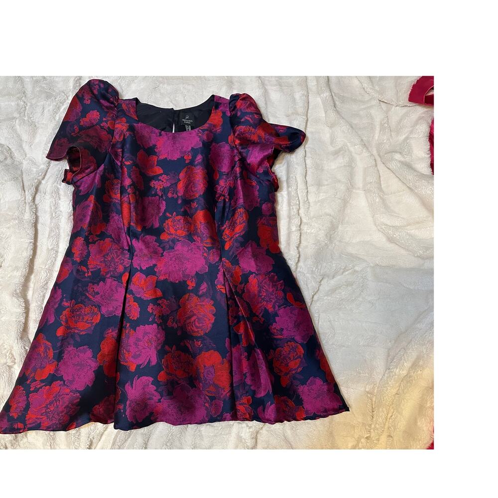 Adrianna Papell dress with a magenta and navy blue floral jacquard pattern.